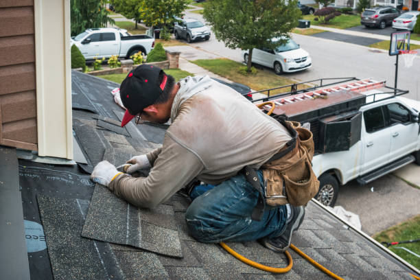 Professional Roof Replacement technician working in Elberon, VA